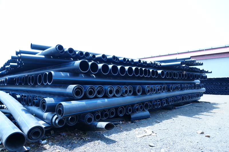 Stacked HDPE pipes at the Aquatic Pipes yard, Rajgarh